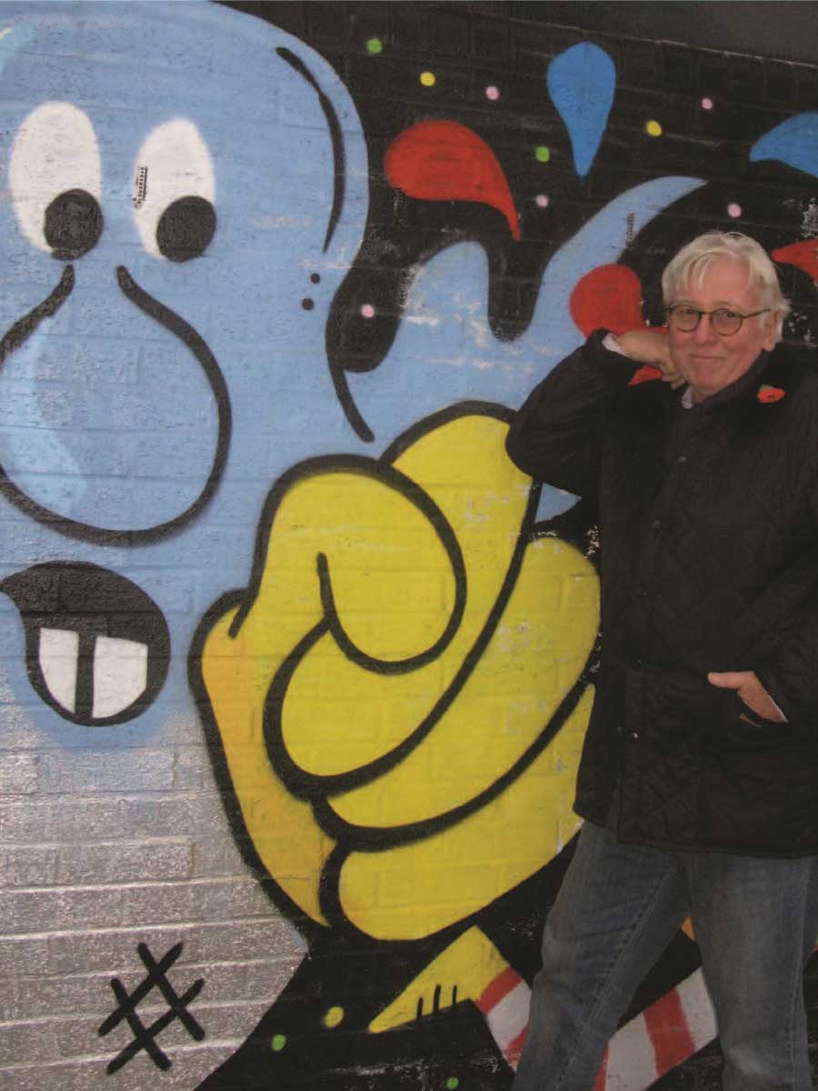 William Conlon in front of Mural